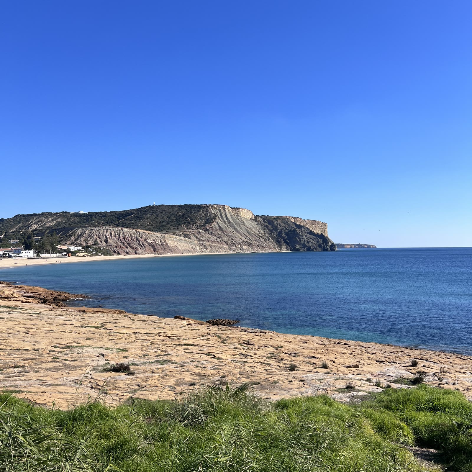 The bay at Praia da Luz with the Rocha Negra headland